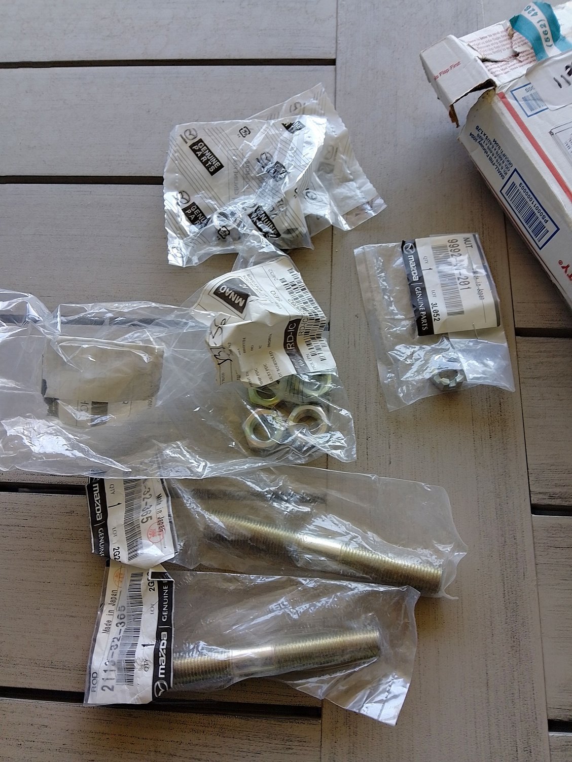 Genuine Mazda adjust link rods and nuts came from Mazdatrix.