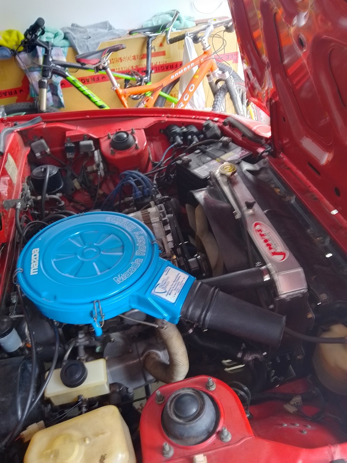 The new PWR radiator and oil cooler are visible. All new oil lines and radiator hoses have been fitted.  The sticker on the air filter is Reliance Automotive.  There is some prestige attached to having a Reliance built engine and from start up it is obvious the engine is very strong.