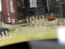 This looks like a good example of a failed capacitor. It should be C6. Note the abnormal blister along its bottom edge.