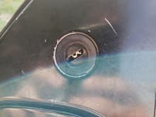 If its that piece ill take 2x, send me your info.

Yes that is a key stuck in there but has been removed 
The black piece spins around but there is no cover to protect the key entry hole.
