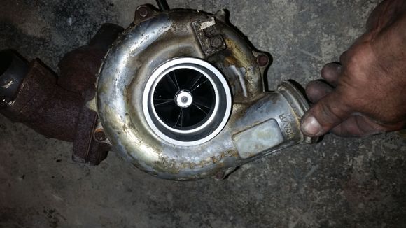 I just picked this up today from the local u pull it. 
Garrett gt35turbo according to garretts website. It was rebuilt recently, has no shaft play and spins smooth. The couple little marks are from me being a dumb ass with my blow tip.the reason it looks so dirty is from me cleaning it with degreaser and brakleen, the dirty marks are actually clear coat. It looks like I have some decisions to make