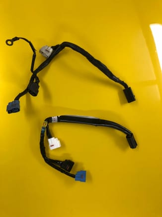 Old ignition harness had a ringlet ground. New harness has an internal ground. 