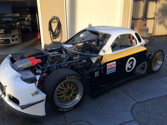 After a year the car is back to a new home for final assembly. Note the front nose tilts for easy loading .
