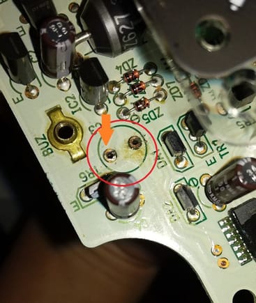 Red Circle shows location of capacitor C3. Orange arrow is the Positive side.