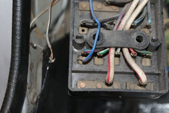 Looks like someone jerry rigged this into the 20A DEFOG AIRCOND fuse.  The two gray wires to the left are just old speaker wire and now gone.
