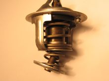 Thermostat removed from 2005 AT RX8. Metal failure. Car was not symptomatic while this was in operation. It was discovered during routine maintenance.