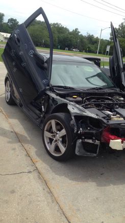 The car was given to me. But it was banged and dented in many areas. Before fixing all of the dents we put lambo hinges on.