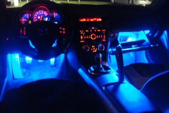 after- interior lit up also have some lights behind the driver and passenger seats so the people in the back have foot lights too.