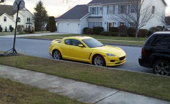 Yellow rx8 with wing and front lip