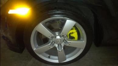 Front brake calipers, painted yellow. Looks good on an NG I think.