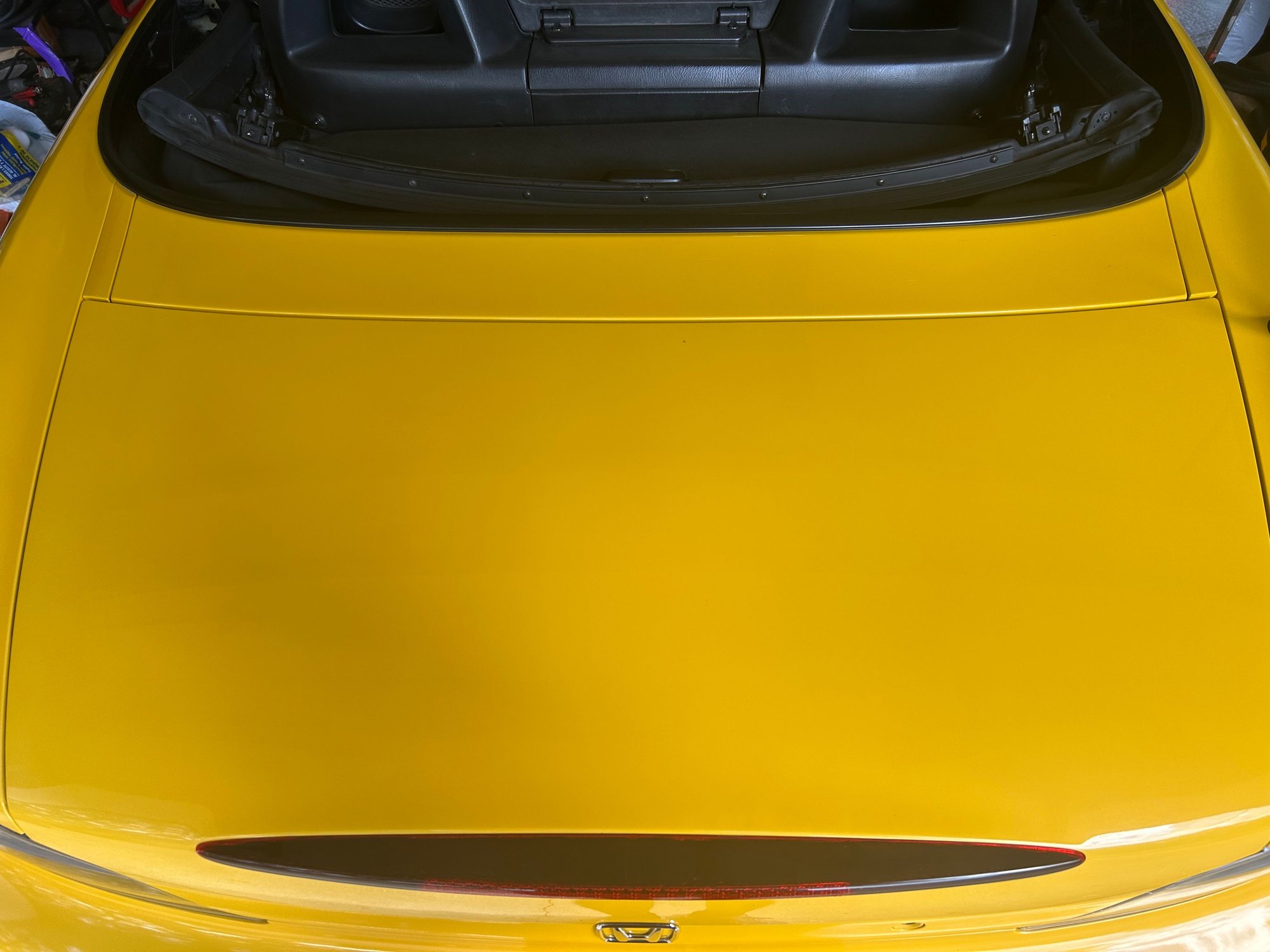 …but the seems/panel gaps look too tight. Then there are the two plastic trim covers in between the trunk and the convertible top. Now I’m wondering if you could make a wing that mounts there??