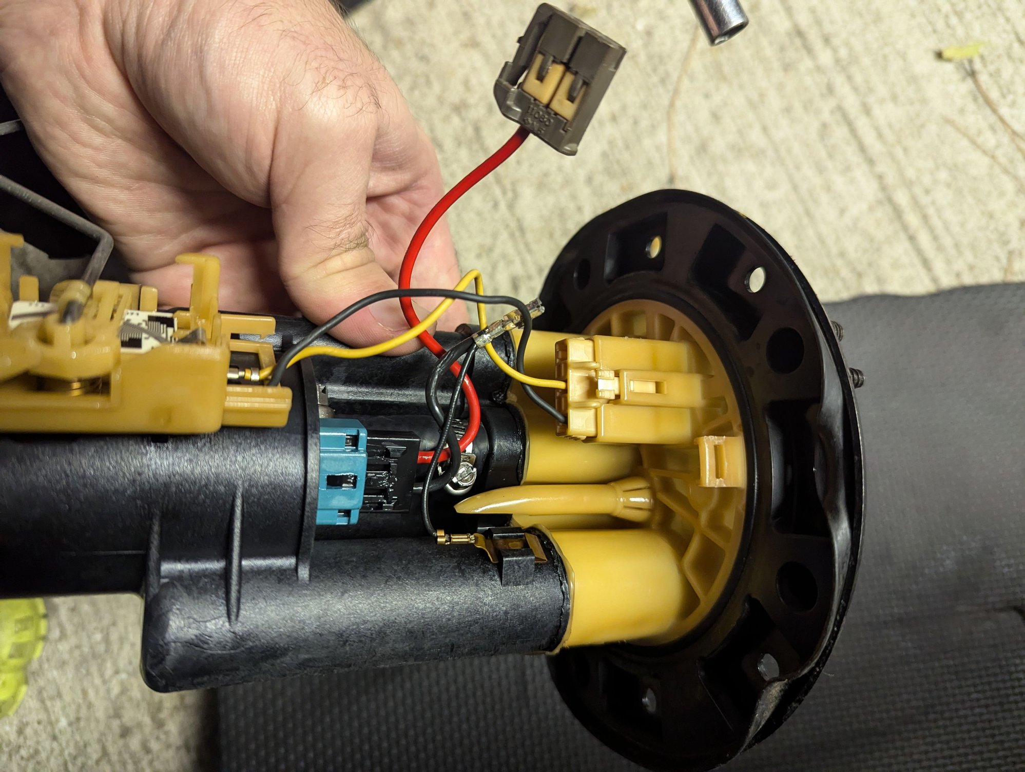 The Black ground wire came out of the connector when I gave it a nudge. It was loose in there. I ended up taking that off and re-crimping a new terminal on to help the two wires fit in the connector housing better.