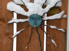 We've collected a number of "faces" that hang on our fence.   Don't bother to bring them in during winter.  