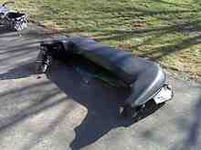 Discarded soft top, still covered by tonneau