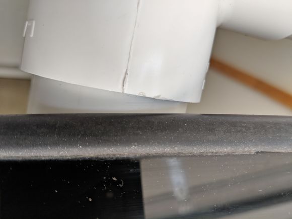 Overspray and mineral impregnated rear bottom