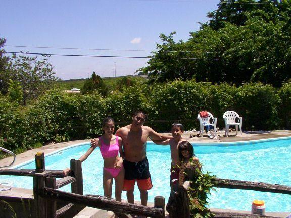 Angel, Alexa, Ethan and Carly by the pool.JPG