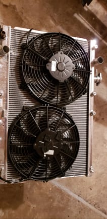 Ended up ditching the shroud in order to fit the air filter properly. CSF raditator with 2 12" SPAL 'medium power' curved fans.  One fan sits lower to clear turbo. Other sits higher in more optimized spot