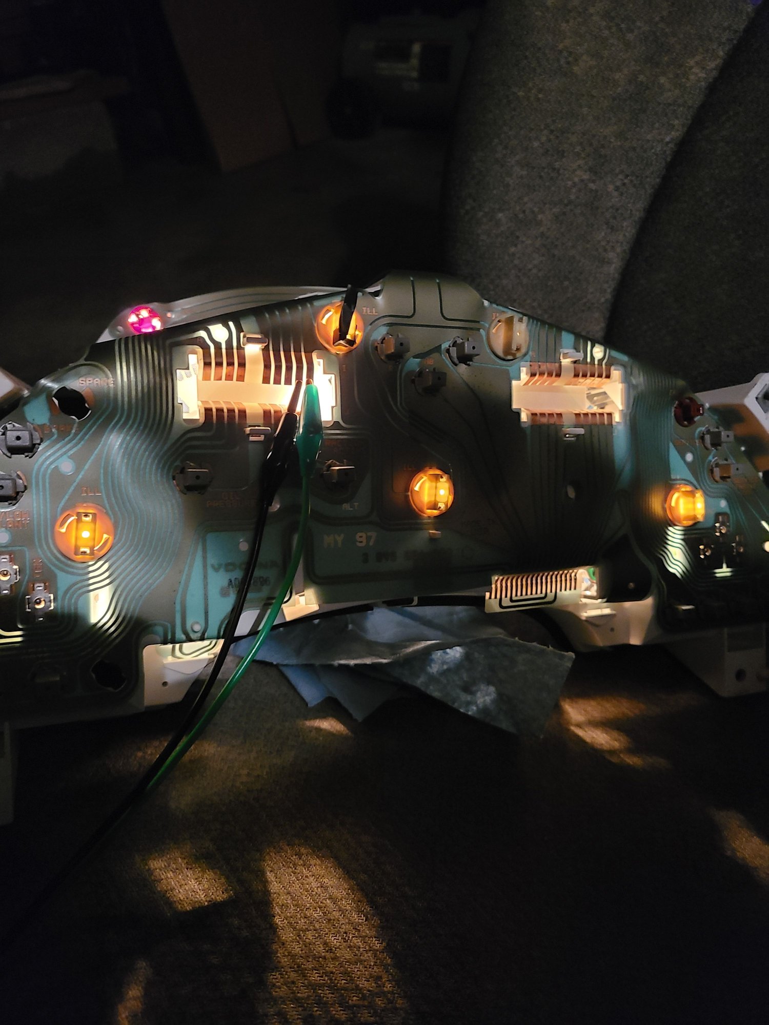 One bulb (upper right) is too dim and needs to be corrected.