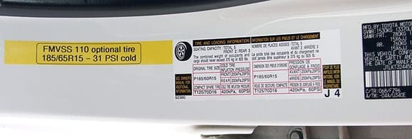 Vanilla's Optional size tire label (home made).

For those who have had any sort of problems with service types refusing to fit non-stock tire sizes on their vehicle, or with state inspections refusing to pass a car with non-stock tires, FMVSS 110 provides for locally applied labels indicating optional size tires and their required inflation.