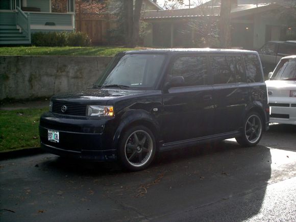 Kathleen's blue 2006 xB with 17's in front of our house.