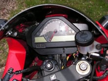 CBR 1000RR instrument cluster mounted on aluminum plate to hide HID ballast. (Needs another temp sensor and SpeedoHealer to work.)