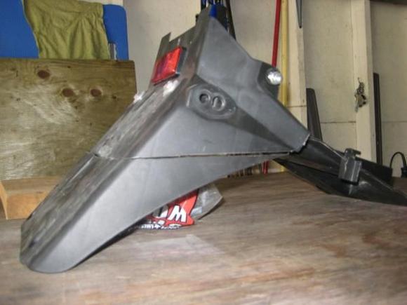 removed portion of seat undertray from side