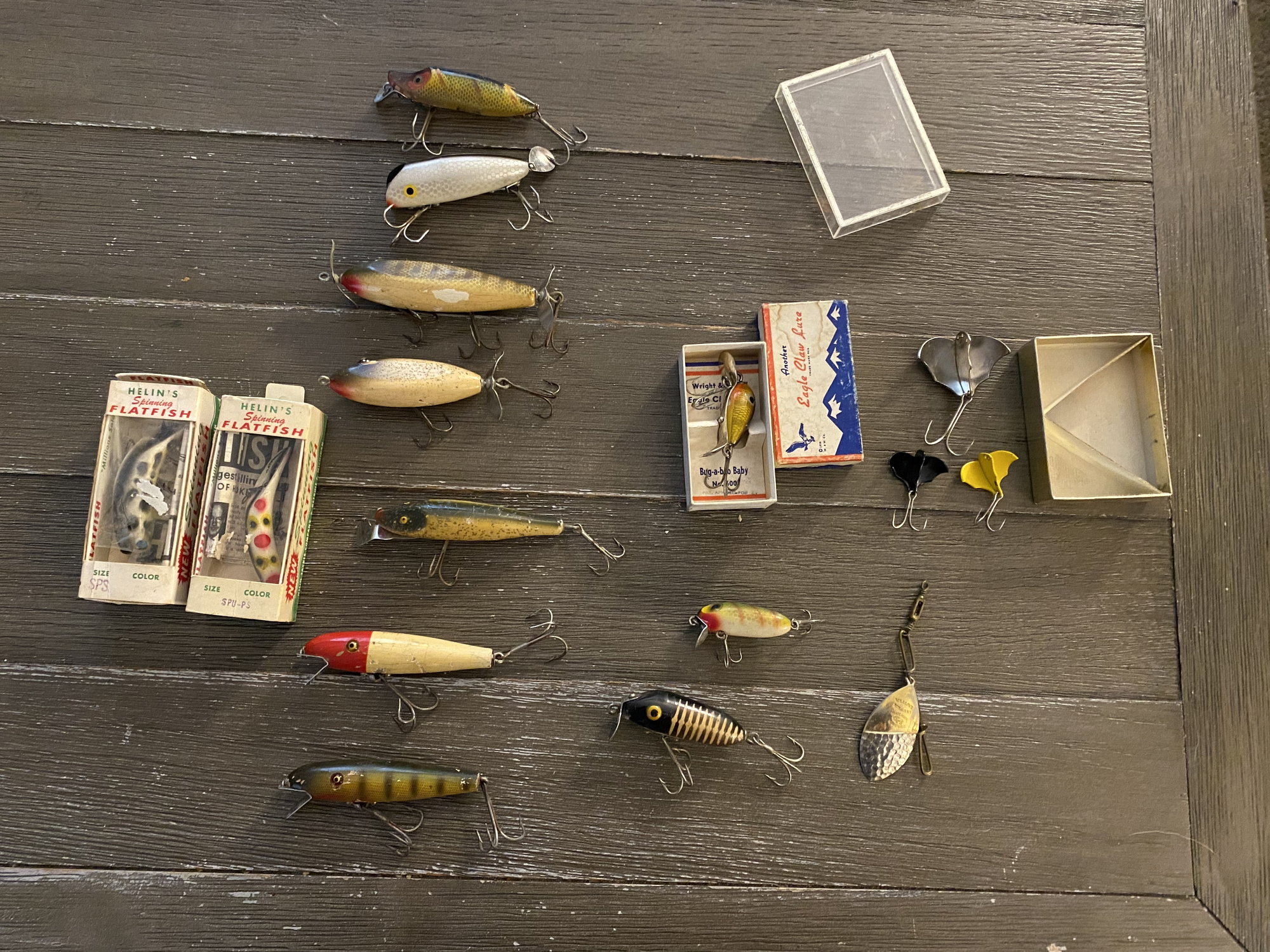Antique fishing lures displayed on vintage net