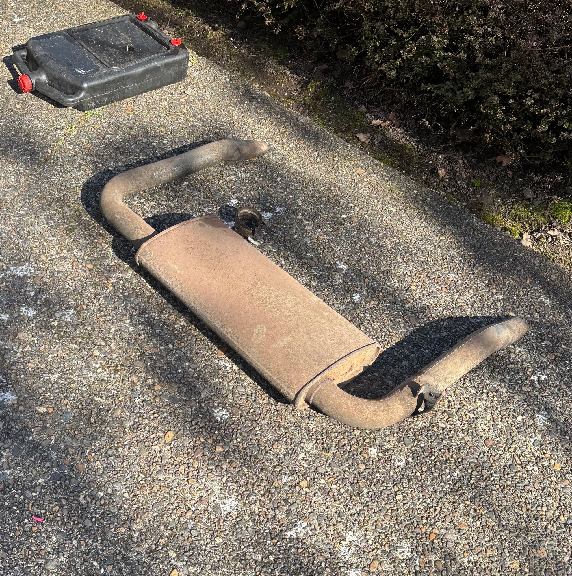 The old muffler.  It was clamped on at the inlet, so I was able to do it all without any welding or cutting of the original pipe.  Once I removed it I saw the whole interior had disintegrated.