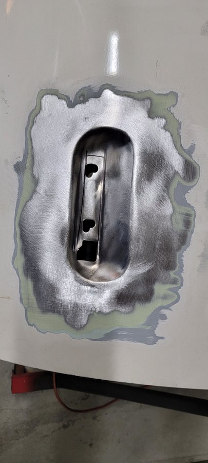 Can see the layers here. Thicker coat of filler than I was expecting. Think once the welding is done, the entire door will need a skim coat and a lot of blocking to get it smooth. 