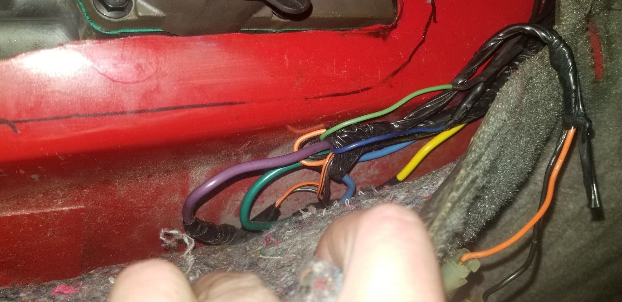 Unfortunately, this is the only pic I got of the spliced up auto shifter harness. Check the pinned T56 swap thread, the wiring is the same! Well cover the last 4 wires on that plug here in a second.... Oh, and the orange and black wires there to the right are for the cigarette lighter