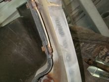 Start of the biggest tear in the lower spoiler top of the picture and a smaller one below.