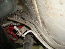 Getting the new front to rear brake line in place.


.