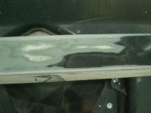 Sanding through paint layers on the door ground effect you can see the factory white, then the silver that Morrison Cook painted it and then black from whoever was the last to race it.