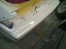 Driver rear bumper cover.
