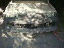 Spoiler bolted back onto the bumper cover.