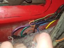 Unfortunately, this is the only pic I got of the spliced up auto shifter harness. Check the pinned T56 swap thread, the wiring is the same! We'll cover the last 4 wires on that plug here in a second.... Oh, and the orange and black wires there to the right are for the cigarette lighter