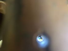 The black you see in the hole is the stud threads.