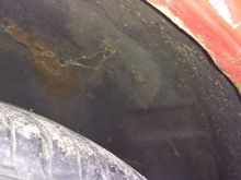 Rust above rear wheel under top......