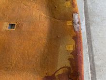Leading edge.  Rust-colored board is the treated part.