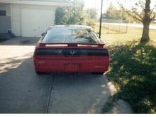 Back of car before paint and 4th gen spoiler