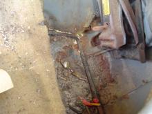 This is where the Spare Tire Rests..  Notice how it's rusted..