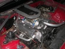 same motor, I just degreased it in the car, added the carb , intake, and headers,