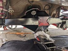 Got it slid under the car and lifted onto my floor jack. Nice and flat on the bottom made it easy to lift level-ish. 