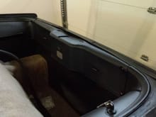Refitting of the rear panels after painting and new carpet fitments.
