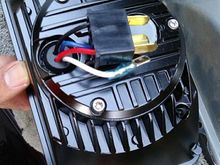 the back side . very plug and play but do have to swap the red and black wires on the headlight harness to match with the LED ones on the VisionX