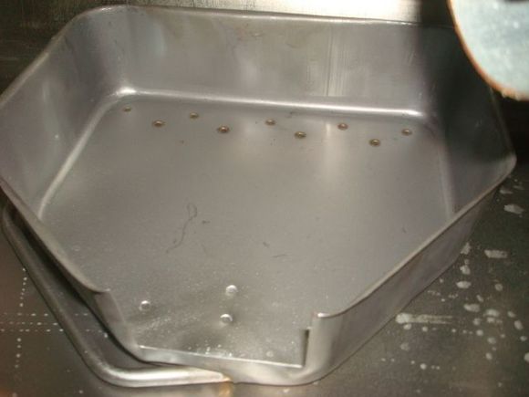 You'll see this one has a much larger fuel pump tray but lacks nearly all the internal walls that the factory tanks have and is mostly just a tank with a tray.