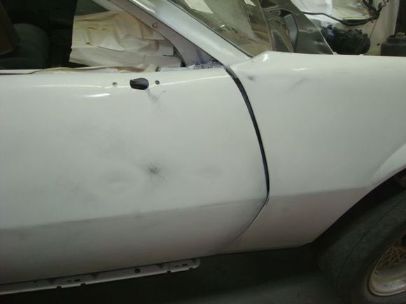 I just put 2 bolts in the top of the fender to hold it while sanding so the gap is way off however the first 2 Morrison Cook cars have what has been referred to as a "drooped nose" where the whole front dog house is pulled down so even once the fender is back is place the gap will still be a little wider at the top than the bottom. One of the guys who drove our Firehawk car back in the 80's asked me if I had figured out how it was done as they wondered how it got through tech.