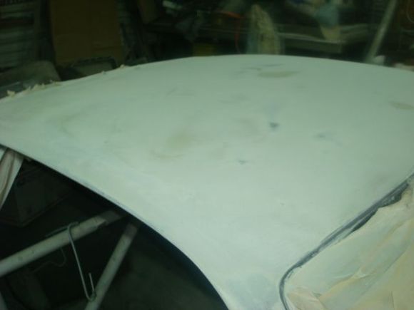Passenger side after blocking. Dark spots are high metal spots, the gold spots are where my bondo was still high and the shiny spots are low spots.