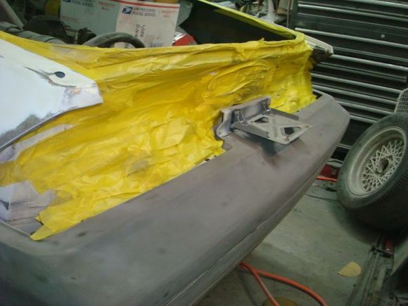 Taping the rear up ahead of spraying epoxy.