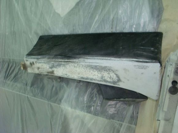 Driver side, its split in half almost. I think its a replacement though as it had writing on the back side.